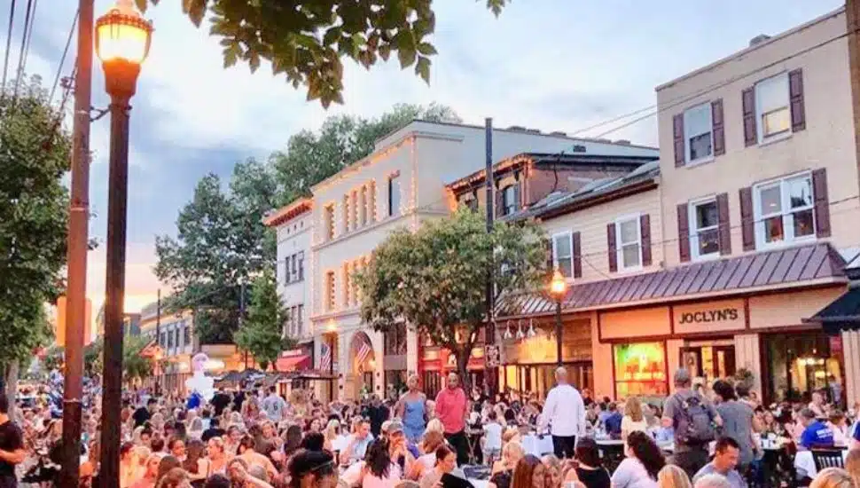 A large crowd of people enjoy some outdoor dining at Media Borough's Dining Under the Stars.