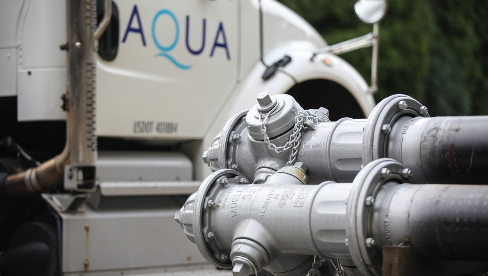 Aqua truck and close up of pipes.