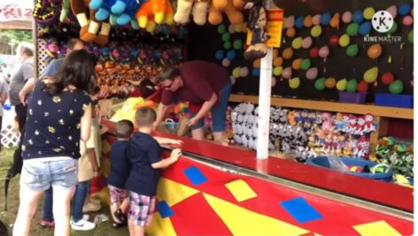 Children try their luck at a Broomall Fire Company carnival game.