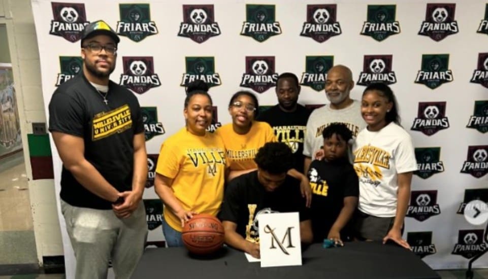 Deuce Ketner signs a commitment to Millersville University.