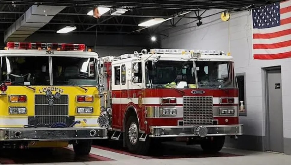 A Leedom Fire Company fire truck sits next to an S.M. Vauclain fire truck in the newly-merged Ridley Township Fire Company No. 1 fire station.