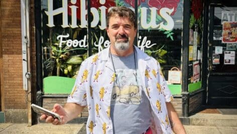 Jim Pappas, sporting a line of cheesesteak-themed clothing outside Hibiscus Cafe in Philadelphia.