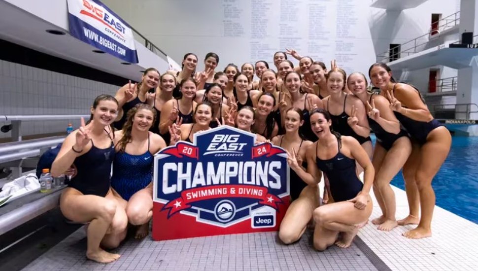 Villanova's swimming and diving team poses for its 11th consecutive Big East title at the Indiana University Natatorium in Indianapolis earlier this year.