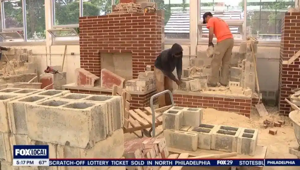 Students at the Williams College of Trades work in the stone and masony classroom at the school.