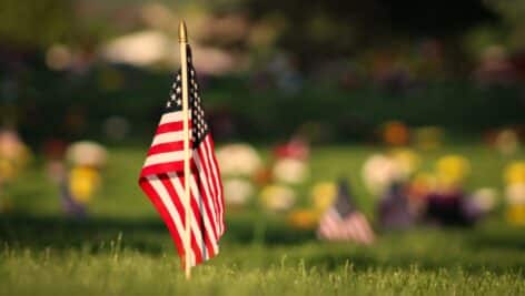 An American Flag placed in a cemetery on Memorial Day in honor of a veteran who died.