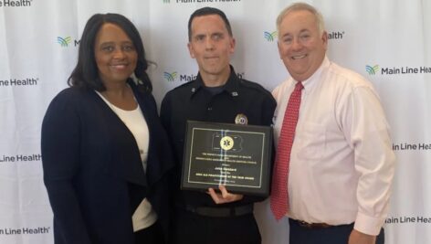 Shelly Buck, president of Riddle Hospital; and Jack Lynch, president and CEO of Main Line Health;, present John Goddard with the Pennsylvania Paramedic of the Year Award