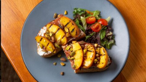 One of the meat dishes, covered with peaches, offered at Broad Table Tavern, a farm-to-table restaurant in Swarthmore.