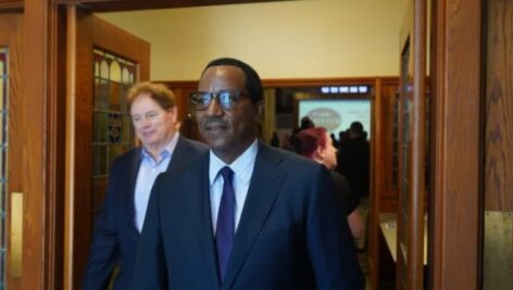 Chester Mayor Stefan Roots leave Widener University's Lathem Hall following his State of the City address.