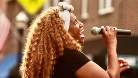 Lisa Chavous at the mic during a performance.