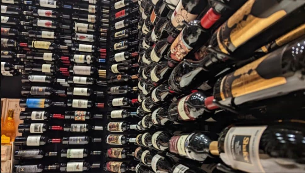 The wine cellar at Tecca Newtown Square restaurant showing rows and rows of wine bottles.