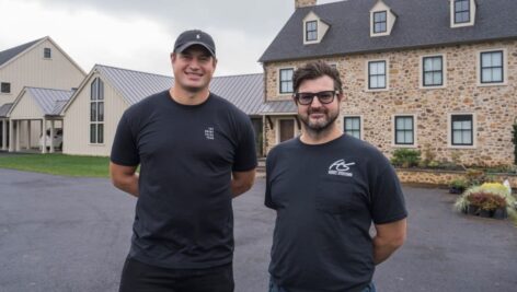 Brent Celek, left, stands outside his home in West Chester.