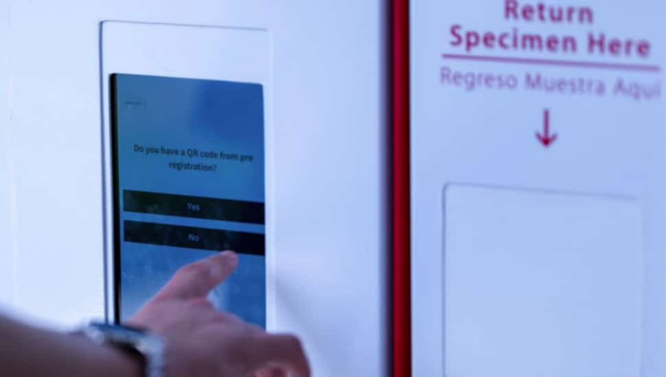 A user tries out a Test and Go public healthcare kiosk. The kiosks will offer free health tests and products.