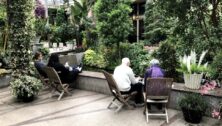 A senior couple relaxing in the Longwood Gardens Conservatory.