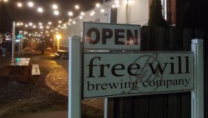 A sign for the Free Will Brewing Company