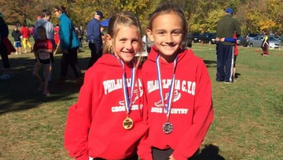 Alli DeLisi and Olivia Cieslak in 2015, best of friends who ended up being two of the top high school middle-distance runners in the country.