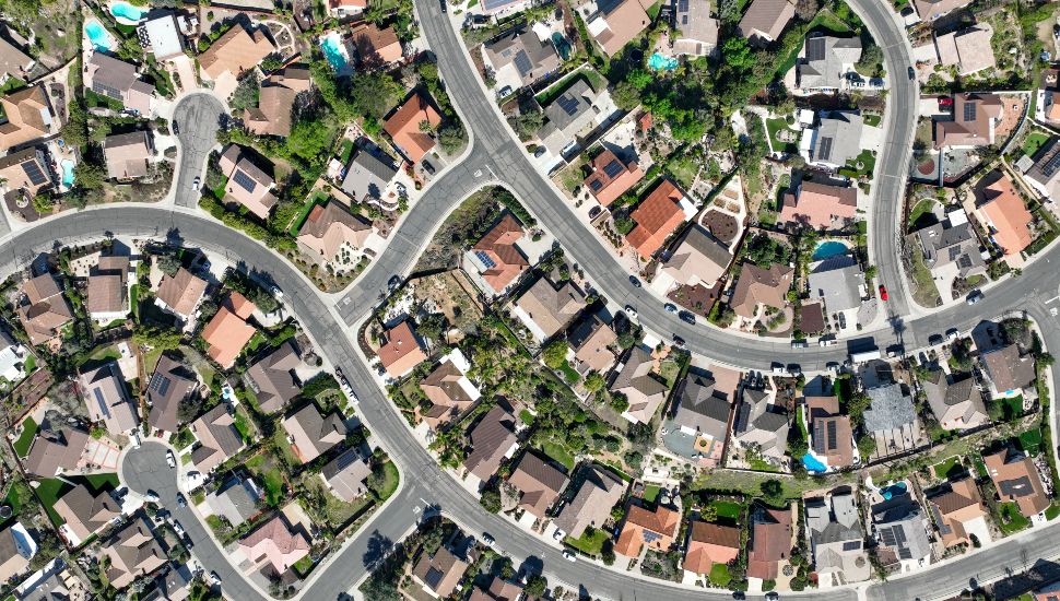 An aerial view of a neighborhood with a large number of homes.