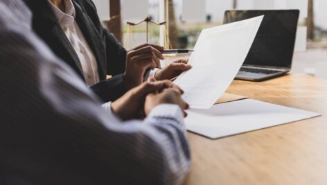 Close up of a financial advisor and a client reviewing options.