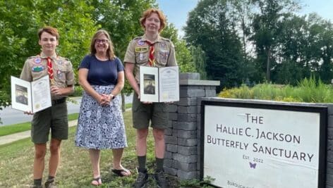 Eagle Scouts Bennett McManus, left, and Andrew McManus, right, were honored recently by State Rep. Leanne Krueger, center, for their contributions and improvements to the Hallie Christine Jackson Butterfly Sanctuary in Brookhaven.