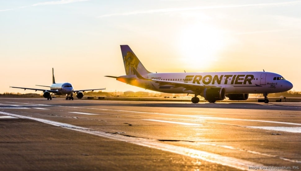 Frontier Airlines aircraft on the runway at Philadelphia International Airport.