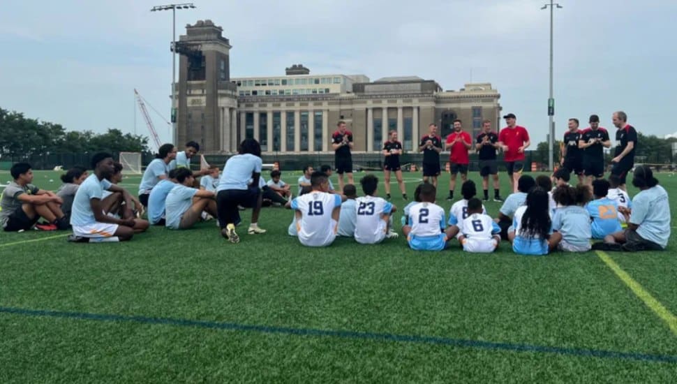 Chester youth soccer players get some tips from visiting coaches in Liverpool, England.