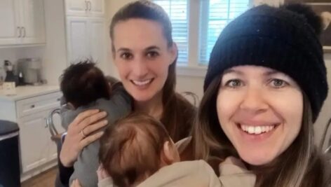 Sarah Todd, left, and Katie Casey hold babies they are fostering.