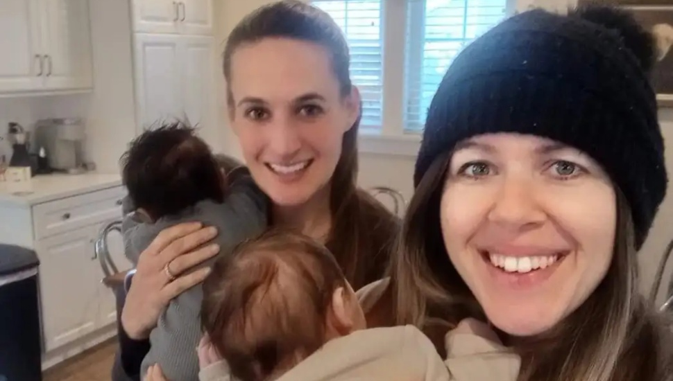 Sarah Todd, left, and Katie Casey hold babies they are fostering.