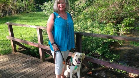 Cindy Lou Altman and her guide dog Crystal.