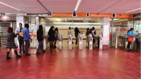 Passengers enter the Broad Street Line at the 15th Street Station near Philadelphia City Hall.