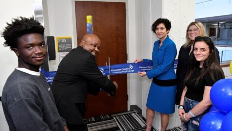 (L to R) Student Alvin Gayee; Dr. Kendrick Mickens, DCCC’s Director, Student Outreach and Success; DCCC President Dr. Marta Yera Cronin and student Sarah Staquet cut the ribbon.