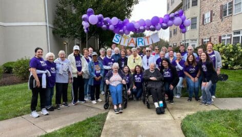 Freedom Village of Brandywine residents gather at the starting line of the walk.