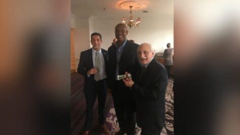 Bob and Marc Virga with Eagles legend Randall Cunningham, getting him to sign a very old "Randall bar" that Bob saved.