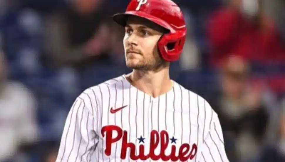 Trea Turner hits the ball with bat.