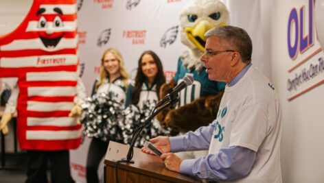 businessman addresses the media at a press conference