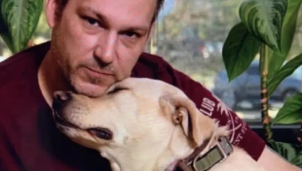 A veteran with his service dog from Alpha Bravo Canine in Newtown.