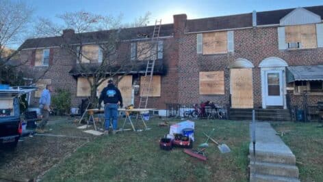 Row homes on Taylor Drive in Folcroft are boarded up after they were damaged in a fire.