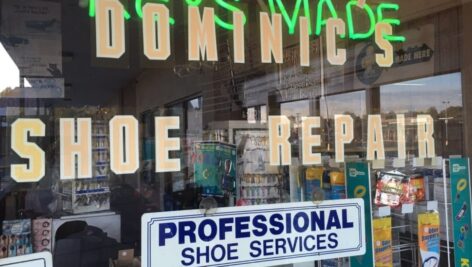 The window sign for Dominic's Shoo Repair in Bensalem.