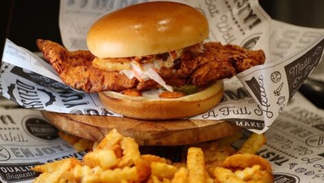 A hot chicken sandwich and fries.