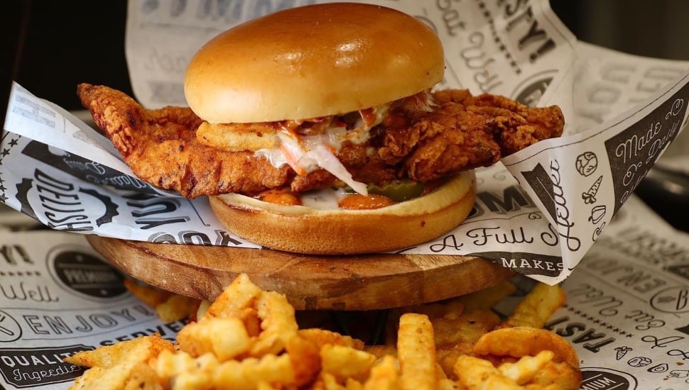 A hot chicken sandwich and fries.