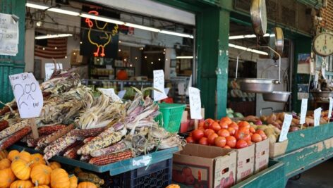 Stalls filled with vegetables and assorted food at the Italian Market.