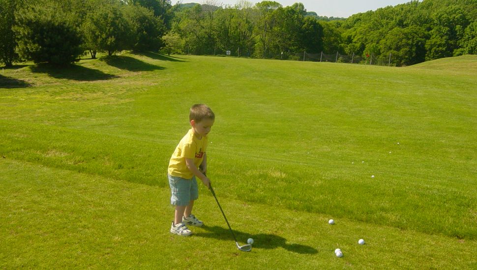 A little boy gets ready to swing at a ball at the Paxon Hollow Country Club.