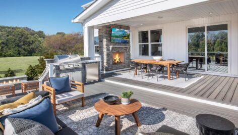 An open deck and yard of a newly-built home.