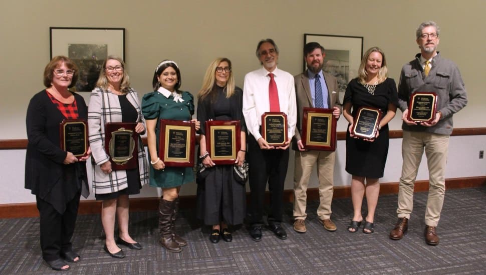 Widener University faculty honored at an Oct. 30 awards ceremony. They are (from left) Donna Callaghan, Karen May, Ria Mazumder, Lori Simons, Michael Cocchiarale, Paul Baker, Katherine Goodrich, and Brian Larson.