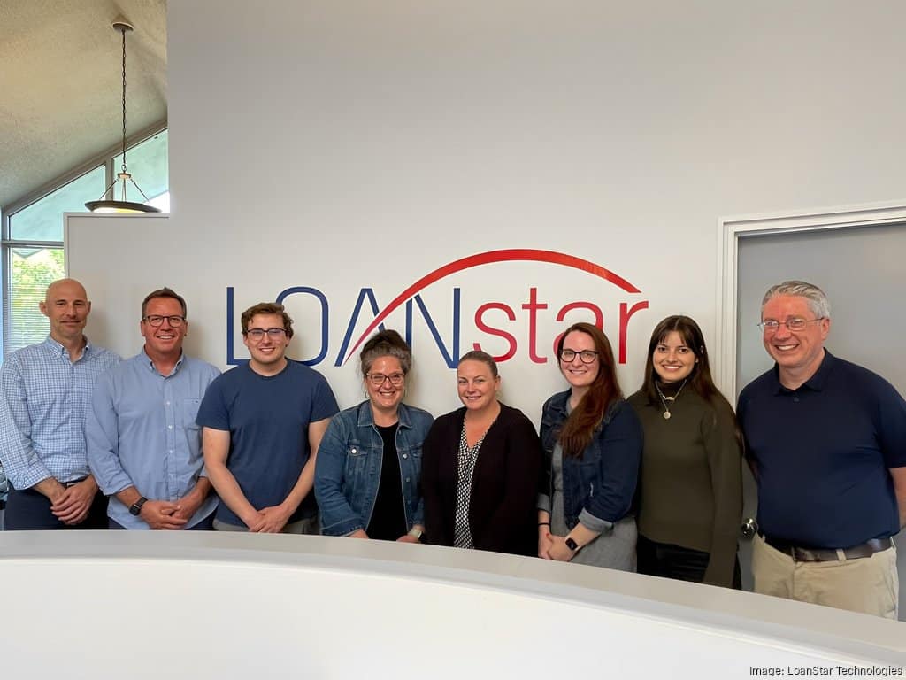 Professionals at LoanStar Technologies in Swarthmore line up for a photo.
