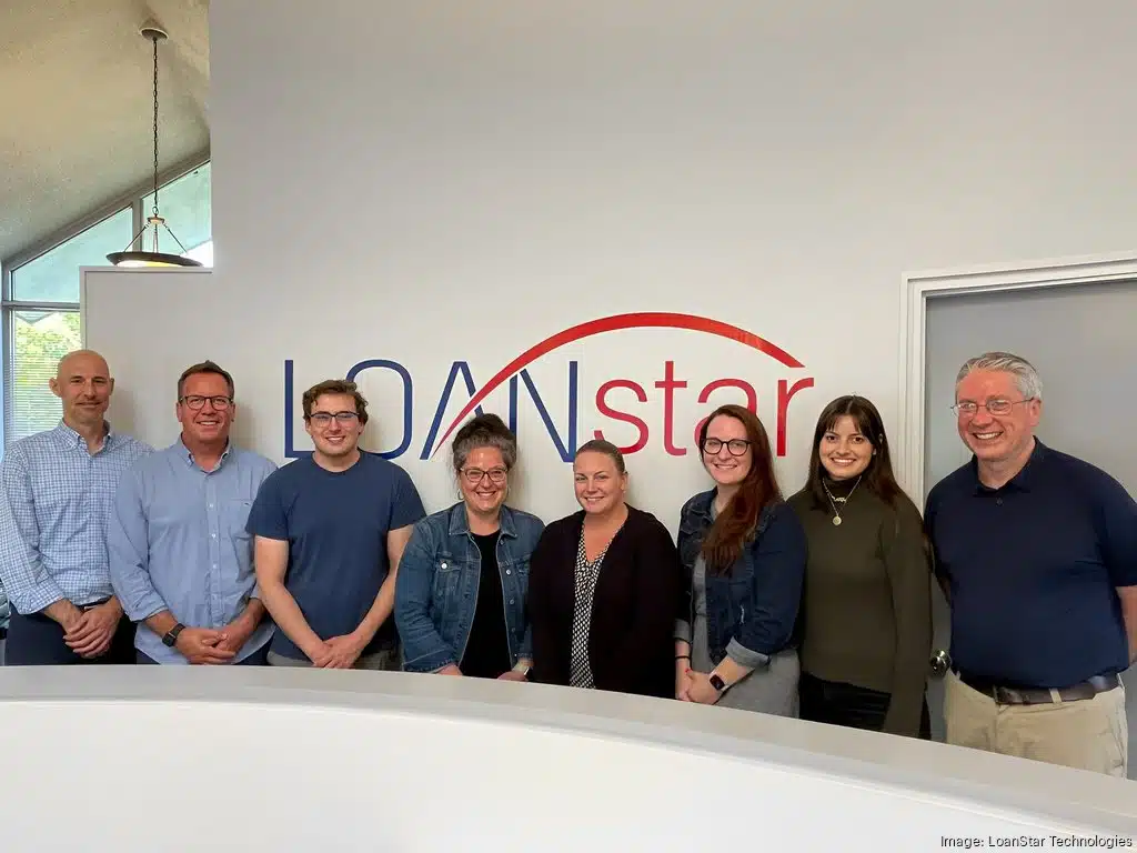 Professionals at LoanStar Technologies in Swarthmore line up for a photo.