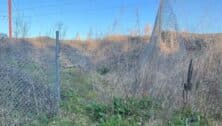 A hole in a fence that led onto Amtrak tracks in Chester, leading to the deaths of two children.