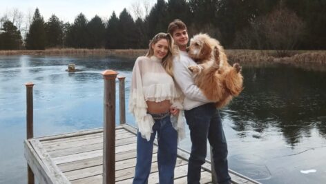 Katherine Asplundth with Cabot Asplundh standing on a dock.