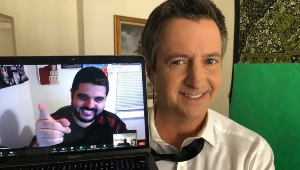 Delco: The Movie director Chris Pierdomenico appears on a computer screen next to Brian Dunkleman.