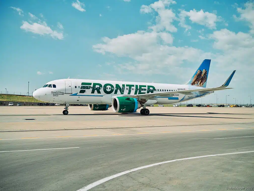 A Frontier Airlines aircraft sitting at the airport.