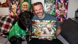 Montgomery County native and artist Jon Metz with one of his pyrography creations.