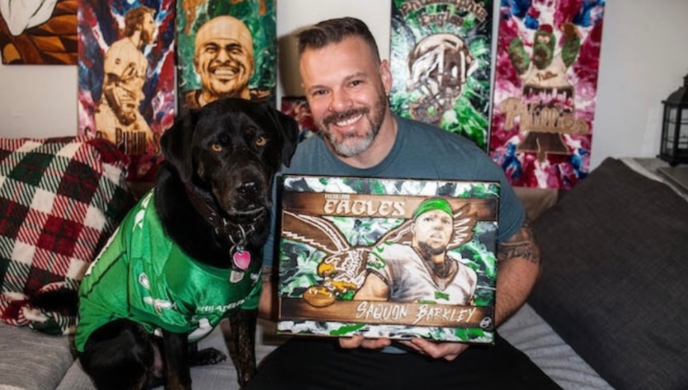 Montgomery County native and artist Jon Metz with one of his pyrography creations.